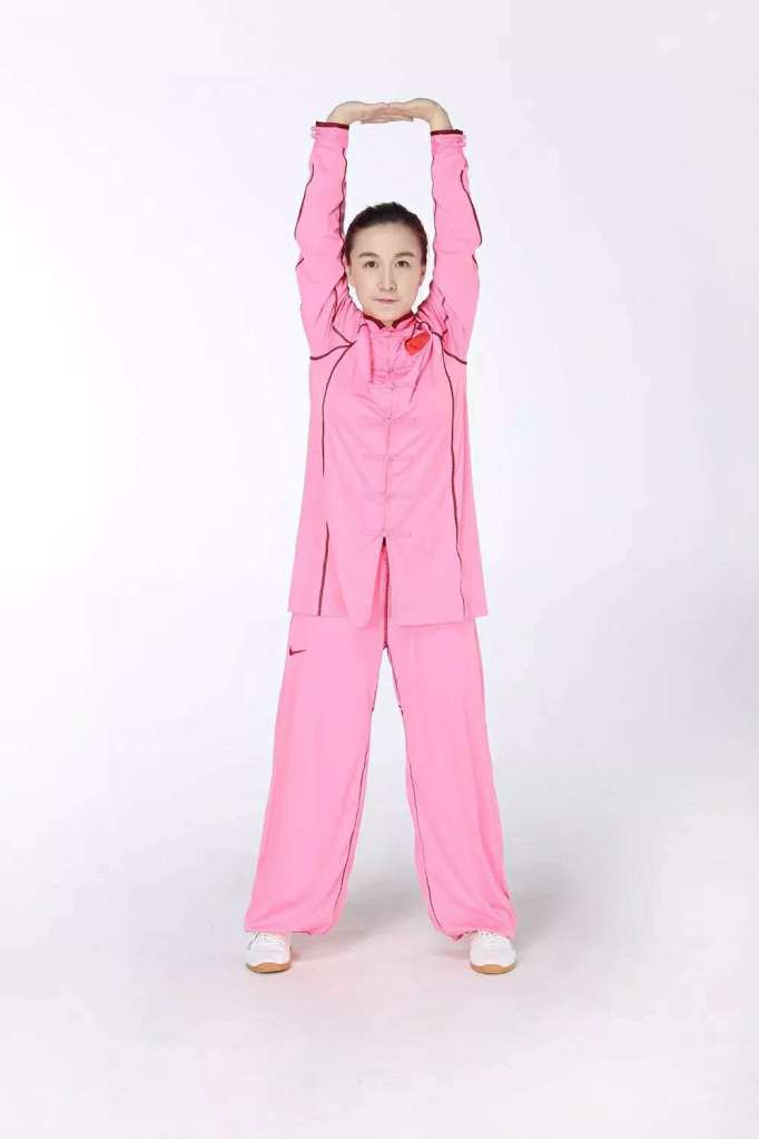 A girl wearing a pink dress

Description automatically generated